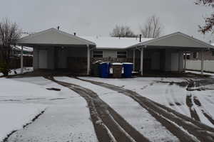 View of front of property featuring a carport