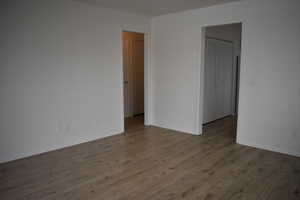 Spare room featuring dark hardwood / wood-style flooring