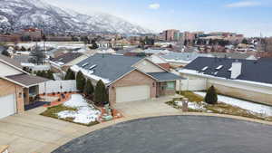 Snowy aerial view featuring a mountain view