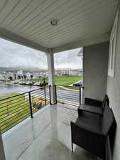 View of patio / terrace featuring a balcony and a water view