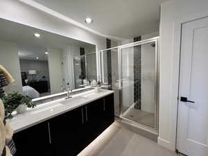 Bathroom with an enclosed shower and vanity