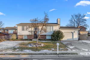 View of front of property with a garage