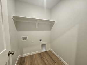 Laundry room with hardwood / wood-style floors, hookup for a washing machine, and electric dryer hookup