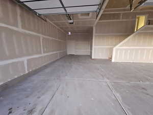 Garage featuring a garage door opener