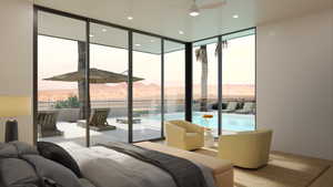 Bedroom with floor to ceiling windows and a mountain view