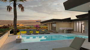 View of pool featuring outdoor lounge area, a mountain view, and a patio