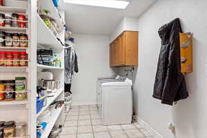 Clothes washing area with cabinets and washing machine and dryer