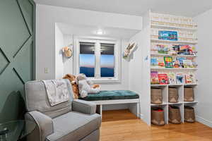 Living area featuring hardwood / wood-style floors