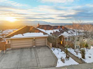 View of front of house featuring a garage and a mountain view