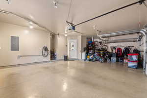 Garage with a garage door opener and electric panel