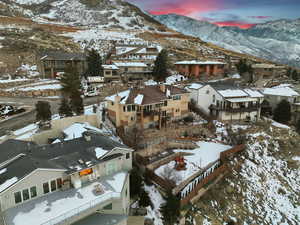 Snowy aerial view featuring a mountain view