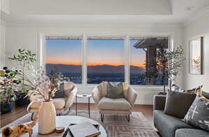 Interior space featuring crown molding, wood-type flooring, plenty of natural light, and a mountain view