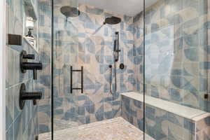 Bathroom featuring tiled shower