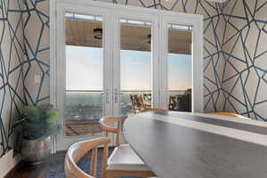 Dining room featuring wood-type flooring and french doors