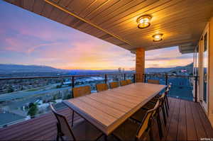 Snow covered deck featuring a mountain view