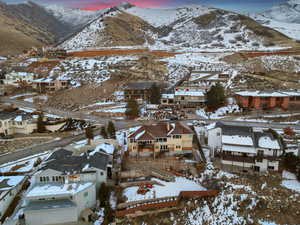 Snowy aerial view featuring a mountain view