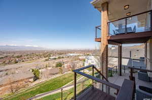 Deck featuring a mountain view and central air condition unit