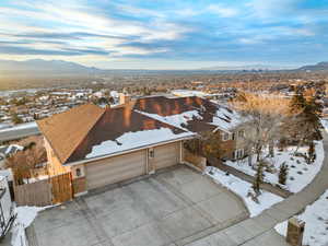 Snowy aerial view featuring a mountain view