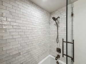 Bathroom featuring tiled shower / bath