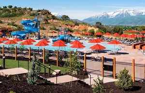 View of swimming pool featuring a playground and a mountain view