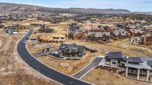 Birds eye view of property with a mountain view