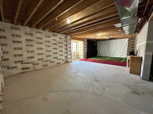 View of basement which has additional shelf area, and oversized utility room for storage and a huge hallway not shown.