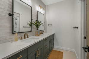 Bathroom featuring backsplash and vanity