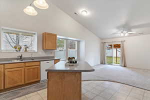 Kitchen with island, Fridge, dishwasher, range and microwave included.