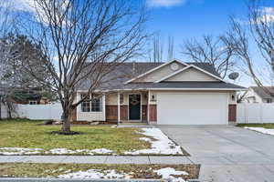 Single level plan with vinyl siding and brick details.