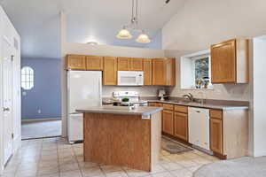 Kitchen with island, Fridge, dishwasher, range and microwave included.