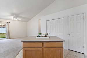 Kitchen with island, Fridge, dishwasher, range and microwave included.