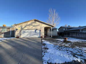 View of front of property featuring a garage