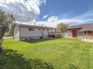 Rear view of property with a deck