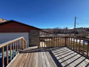 Wooden terrace with a garage