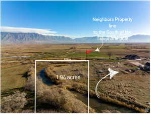 Birds eye view of property featuring a mountain view and a rural view