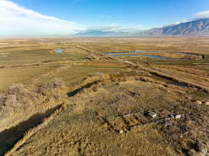 Birds eye view of property featuring a mountain view and a rural view