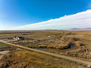 Birds eye view of property featuring a mountain view and a rural view