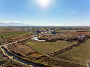 Birds eye view of property with a rural view and a mountain view