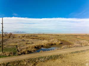 Drone / aerial view with a water view and a rural view