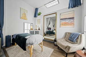 Bedroom with wood-type flooring