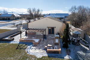 Back of house with a pergola and a patio