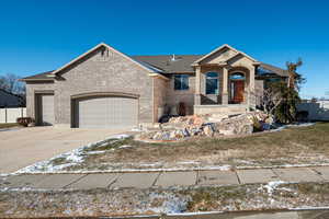 View of front of property featuring a garage