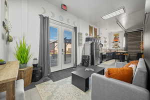 Living room featuring french doors and sink