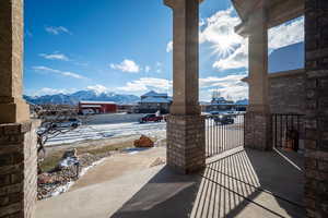 Snow covered patio featuring a mountain view