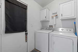 Clothes washing area with independent washer and dryer and cabinets