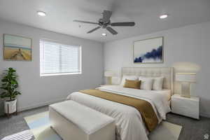 Bedroom with ceiling fan and dark carpet