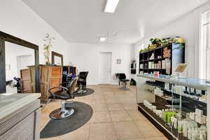 Miscellaneous room featuring light tile patterned flooring and a wealth of natural light