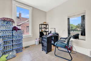 Office area with light tile patterned floors