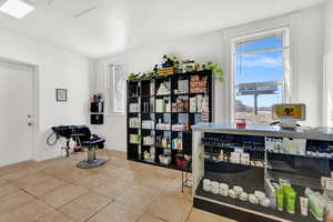 Miscellaneous room with light tile patterned floors