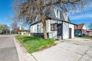 View of property exterior featuring a yard